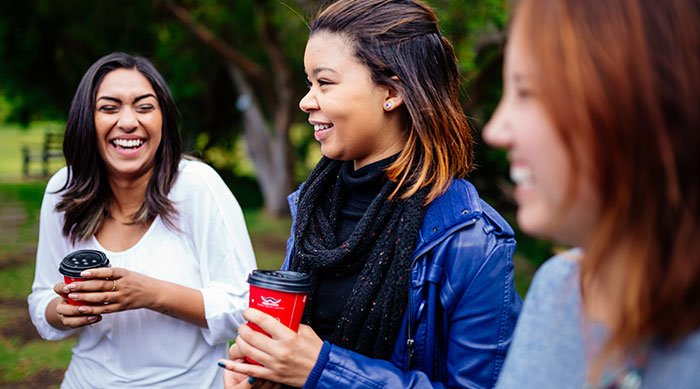 young women laughing together
