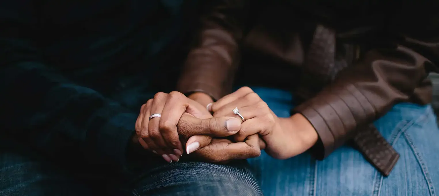 Couple holding hands