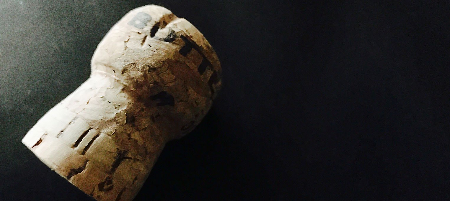 Wine cork on black background