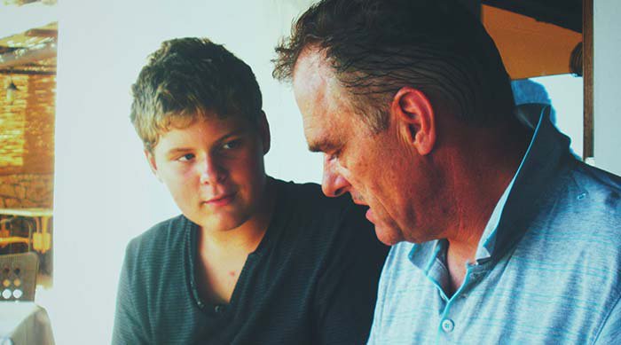 father talking to teen son