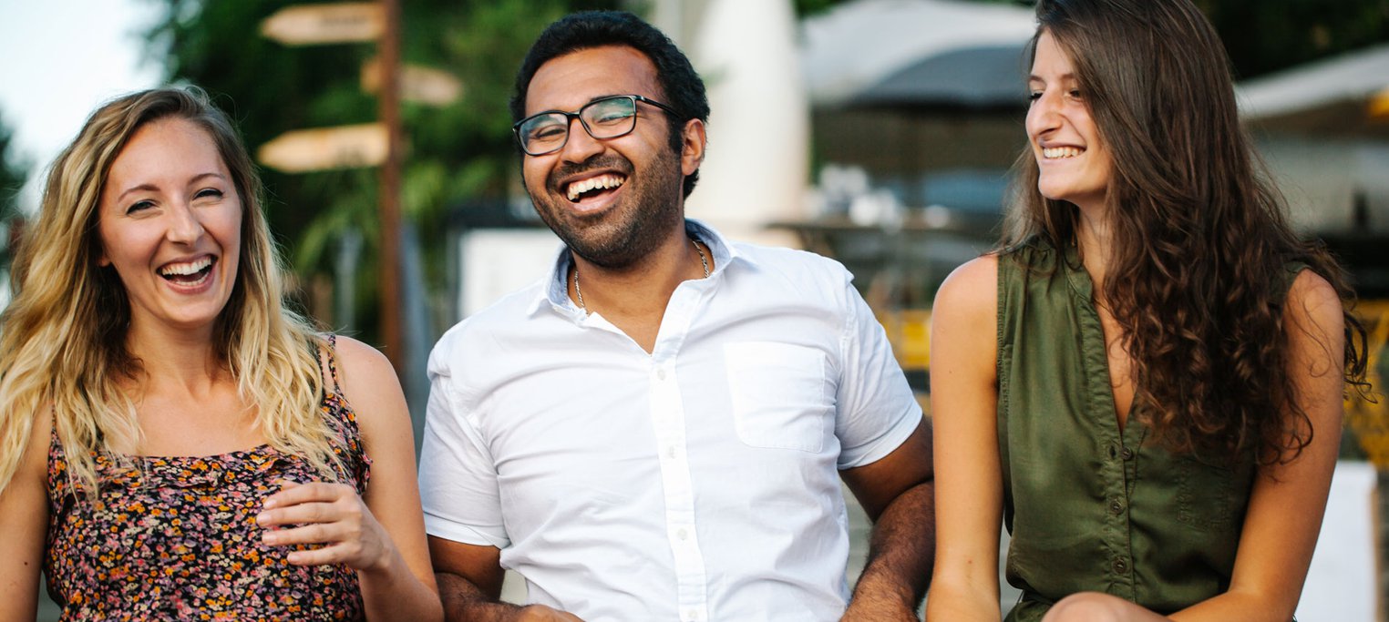 three friends enjoying a laugh