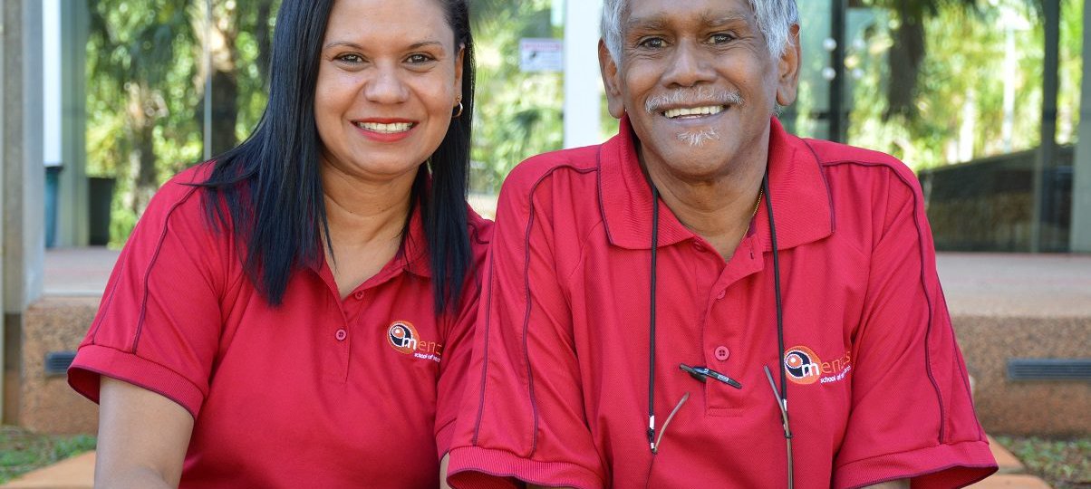 father and daughter in red polo shirts