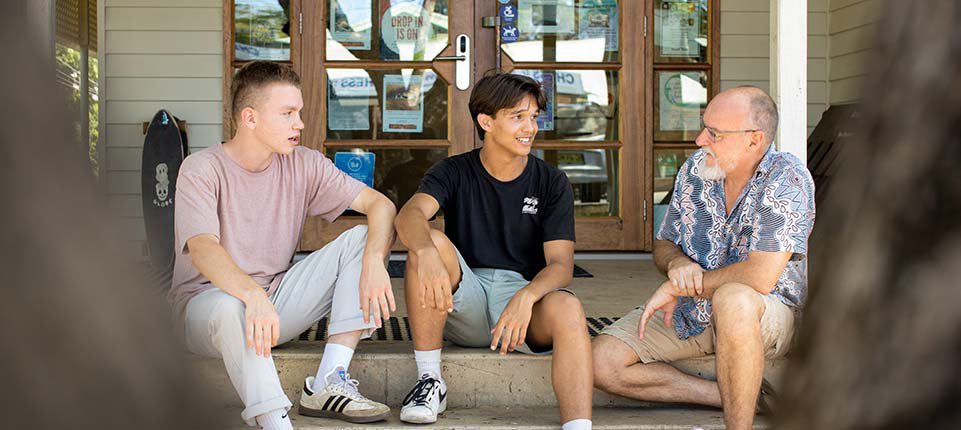 Mentor talking to young men