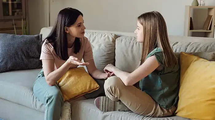 Mother and daughter talking