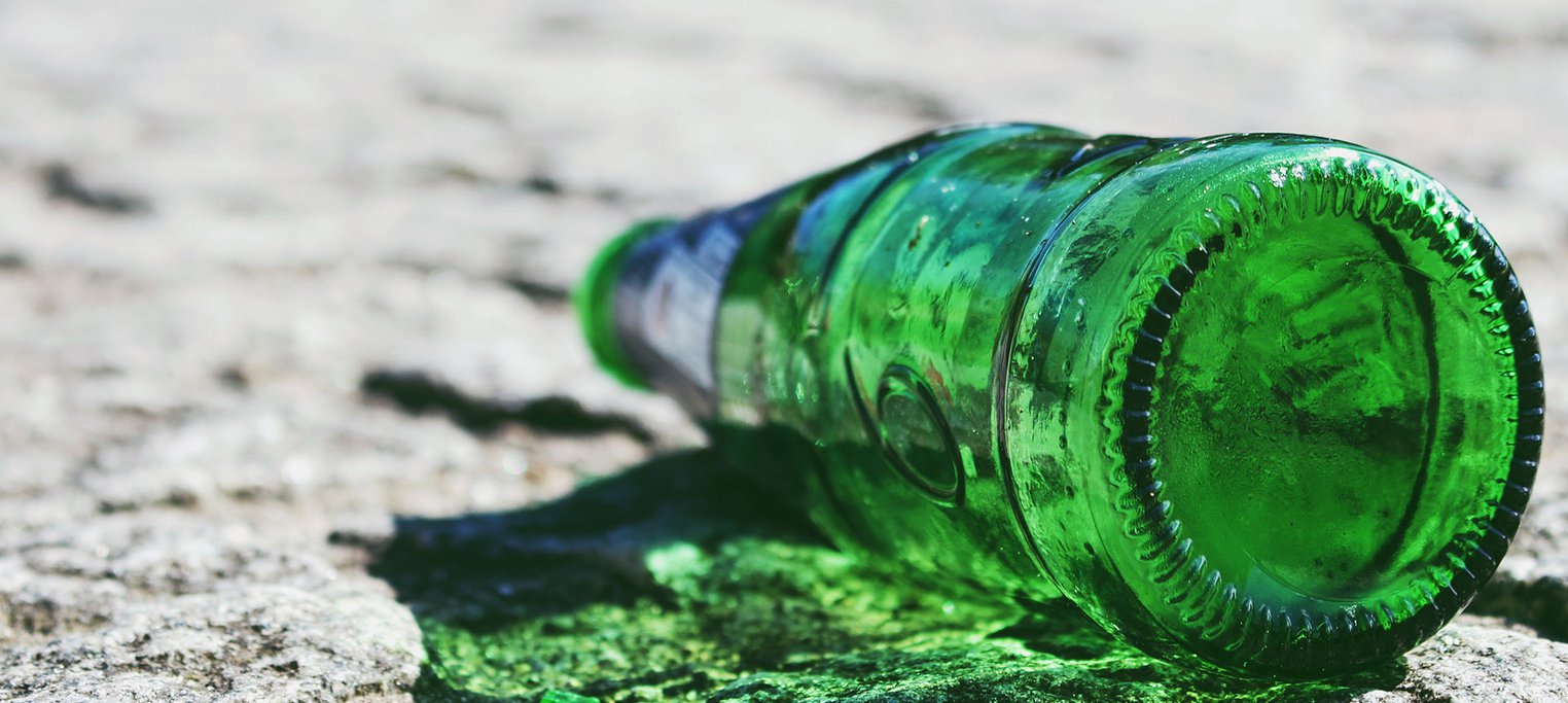 Empty beer bottle on the ground