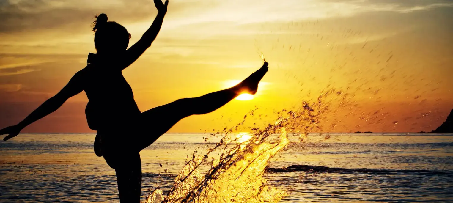 woman having fun kicking up water
