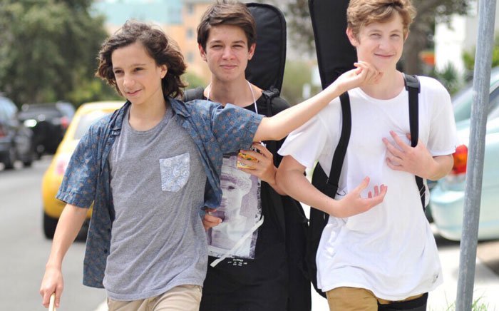 Teenagers walk to band practice