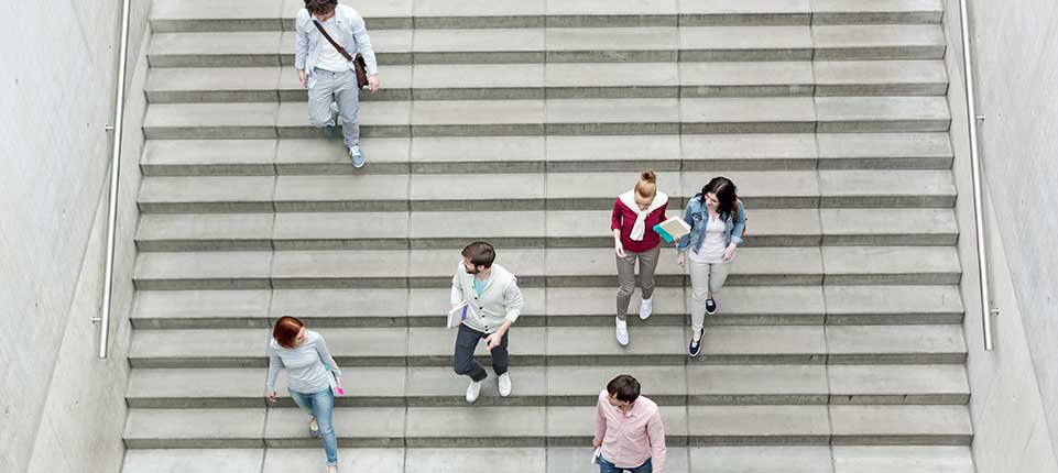 Young people walking down stairs