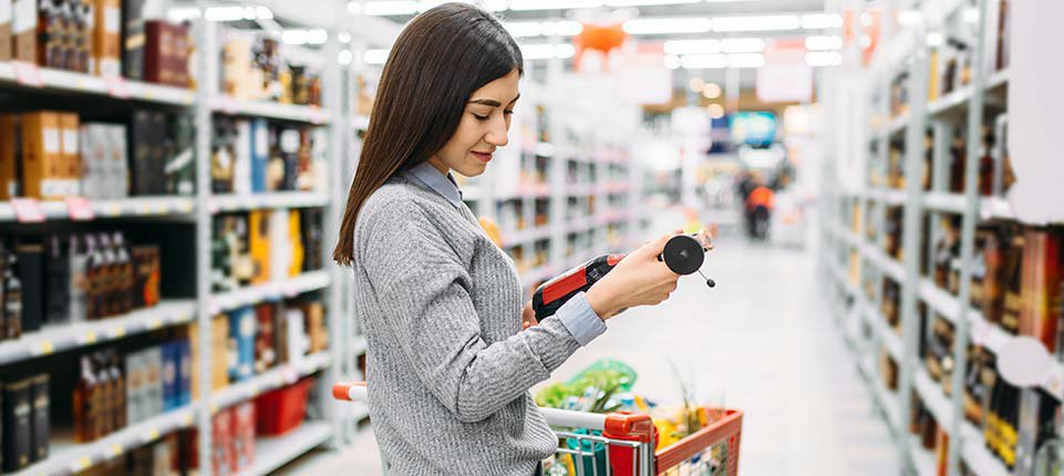 Woman buying non-alcoholic wine