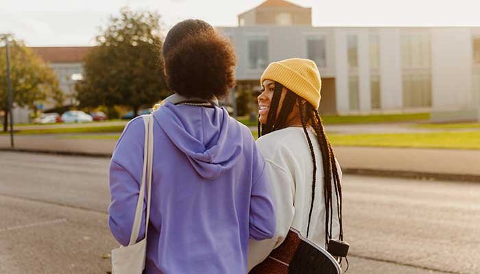 young friends walk to school